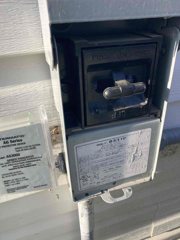 Completed preventive maintenance agreement visit for residential air conditioning system. Performed comprehensive inspection of outdoor disconnect box and indoor air handler unit, verified proper electrical connections and safety devices including Intermatic AG3000 protective device, confirmed operational status of all components with system running normally as indicated by illuminated status LED. All equipment photographed and documented per maintenance agreement requirements.