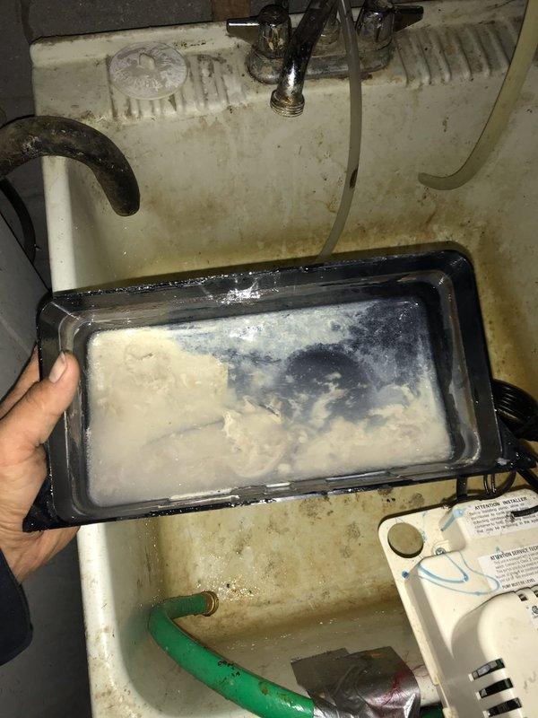 # HVAC Maintenance - Agreement Visit AC&SI Completed

Performed routine maintenance on club AC8-12 system. Upon inspection, discovered severely clogged condensate drain line with extensive ice blockage containing debris and contaminants. Removed frozen blockage from drain line and documented condition. Condensate pump showed heavy brown staining, mineral buildup, and biological growth throughout reservoir and internal components, indicating prolonged drainage issues. Cleared drain line obstruction, flushed system, and verified proper condensate flow. Cleaned accessible components of pump assembly and confirmed operational functionality. System restored to proper drainage operation.