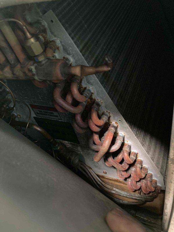 Completed routine preventive maintenance inspection on residential air conditioning system as part of club membership agreement. Inspected blower wheel assembly, noting normal operational dust accumulation on fan blades with components functioning within acceptable parameters. Examined refrigerant line set and observed surface oxidation on copper piping consistent with age and environmental exposure, though lines remain structurally sound with no visible refrigerant leaks detected.