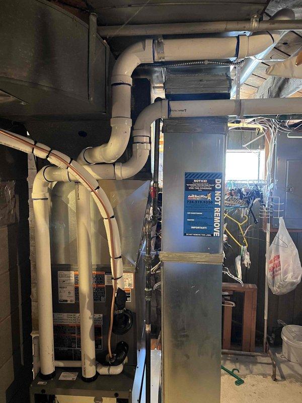 Completed full HVAC system installation including a 70,000 BTU furnace and 2-ton air conditioning unit with rear discharge configuration. Installed new furnace with proper venting system using PVC piping, secured all condensate drainage lines, and completed all ductwork connections. Performed electrical hookup, reconnected all mechanical and electrical components, verified proper operation of both heating and cooling systems, and ensured all safety labels and manufacturer specifications were in place.