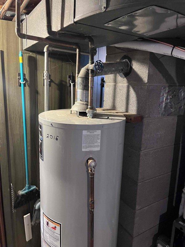 Completed full HVAC system installation including a 70,000 BTU furnace and 2-ton air conditioning unit with rear discharge configuration. Installed new furnace with proper venting system using PVC piping, secured all condensate drainage lines, and completed all ductwork connections. Performed electrical hookup, reconnected all mechanical and electrical components, verified proper operation of both heating and cooling systems, and ensured all safety labels and manufacturer specifications were in place.