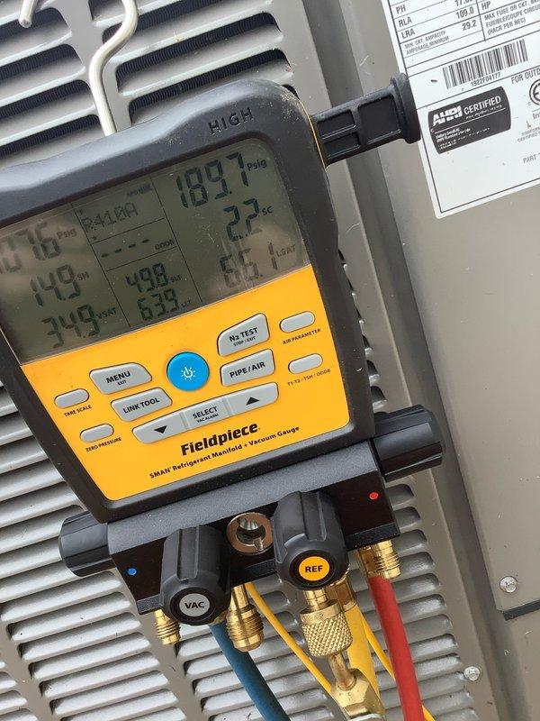 Completed preventive maintenance agreement visit on residential air conditioning system. Performed electrical diagnostics using digital multimeter, recording voltage readings and verifying proper amperage draw on condensing unit. Utilized refrigerant manifold gauges to measure system pressures and superheat/subcooling values, confirming refrigerant charge at 189.7 PSIG with 2.2°F subcooling within manufacturer specifications. System operating efficiently with no deficiencies noted.