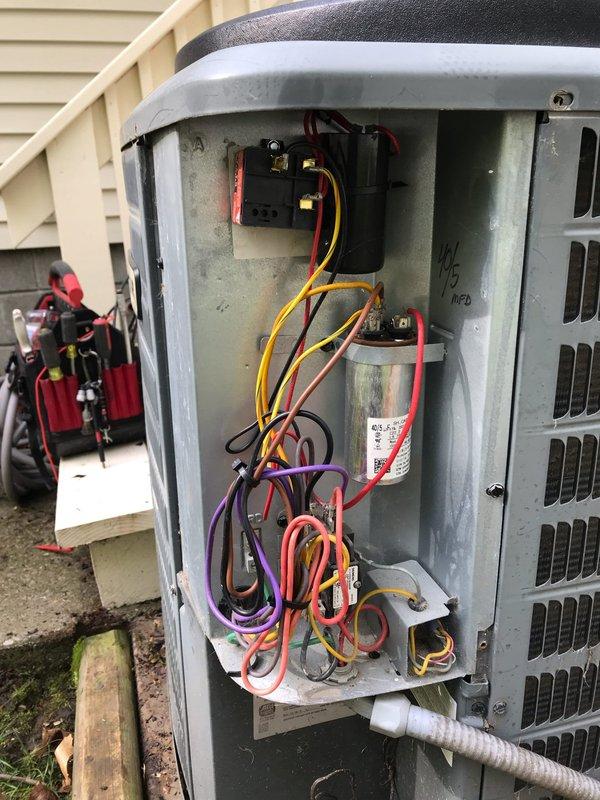 Completed scheduled maintenance visit for air conditioning system. Performed inspection of outdoor condensing unit, which showed heavy accumulation of dirt and debris on exterior coil surfaces. Accessed electrical compartment to verify proper operation of capacitor, contactors, and control wiring connections. All electrical components functioning within normal parameters despite visible age-related wear on interior surfaces.