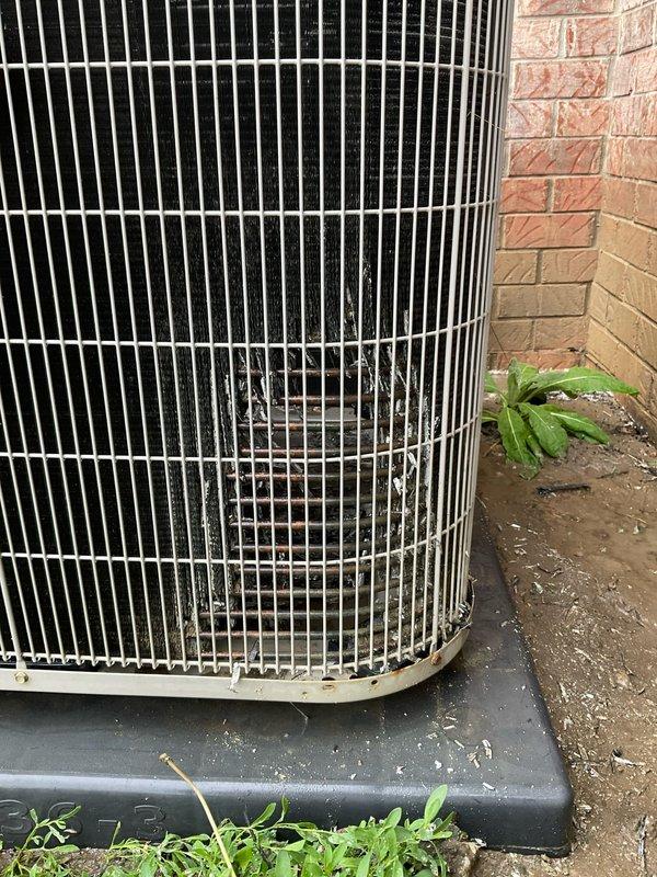 Completed seasonal preventative maintenance inspection on residential air conditioning system under club membership agreement. Performed comprehensive visual inspection of outdoor condenser unit, noting accumulated dirt and debris on exterior grille and protective pad requiring standard cleaning as part of routine maintenance protocol. Unit operational and positioned properly on protective base pad against building foundation with adequate clearance for airflow.