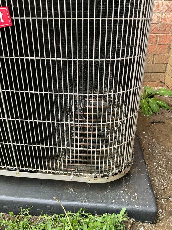 Completed seasonal preventative maintenance inspection on residential air conditioning system under club membership agreement. Performed comprehensive visual inspection of outdoor condenser unit, noting accumulated dirt and debris on exterior grille and protective pad requiring standard cleaning as part of routine maintenance protocol. Unit operational and positioned properly on protective base pad against building foundation with adequate clearance for airflow.