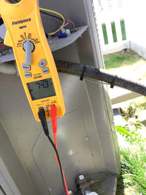 Completed Club AC8-12 preventive maintenance agreement visit on residential air conditioning system. Performed comprehensive system diagnostics using Fieldpiece SC440 multimeter to verify electrical parameters, obtaining readings of 743 on control circuits. Connected Fieldpiece manifold gauge set with three-hose configuration to measure system pressures and temperatures, recording superheat and subcooling values including temperatures of 148°F, 207°F, and 137°F to confirm proper refrigerant charge and system operation. Inspected unit housing, electrical connections including wire-nutted control wiring, and manufacturer specification labels. All safety warning labels present and legible. System operating within normal parameters with no deficiencies noted. Unit left in proper working condition.
