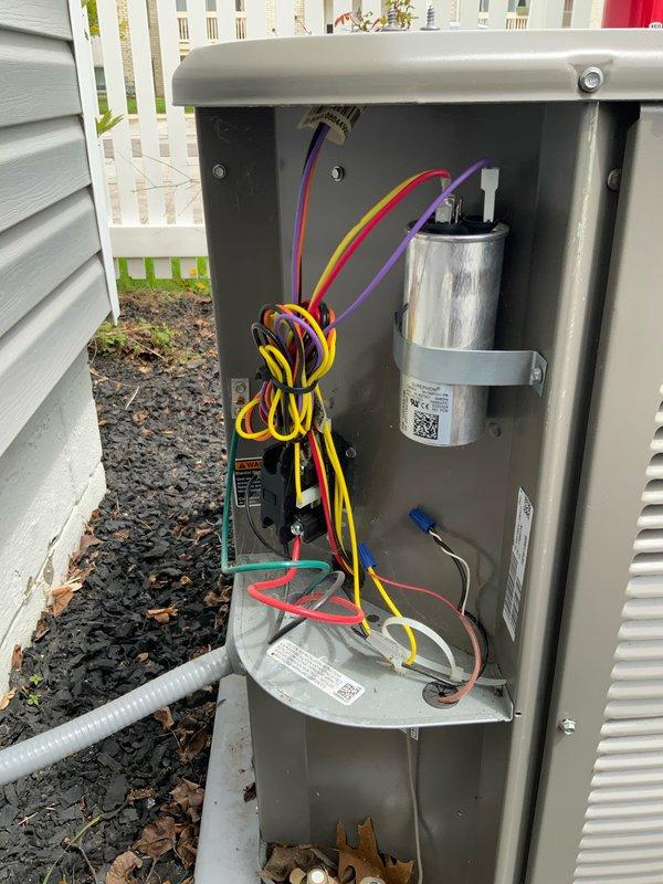 Performed preventive maintenance tune-up on air conditioning system and installed customer-provided thermostat as requested. Inspected blower assembly and electrical disconnect panel, confirming all components including capacitor, contactors, and wiring connections were in good working condition with no signs of wear or deterioration.
