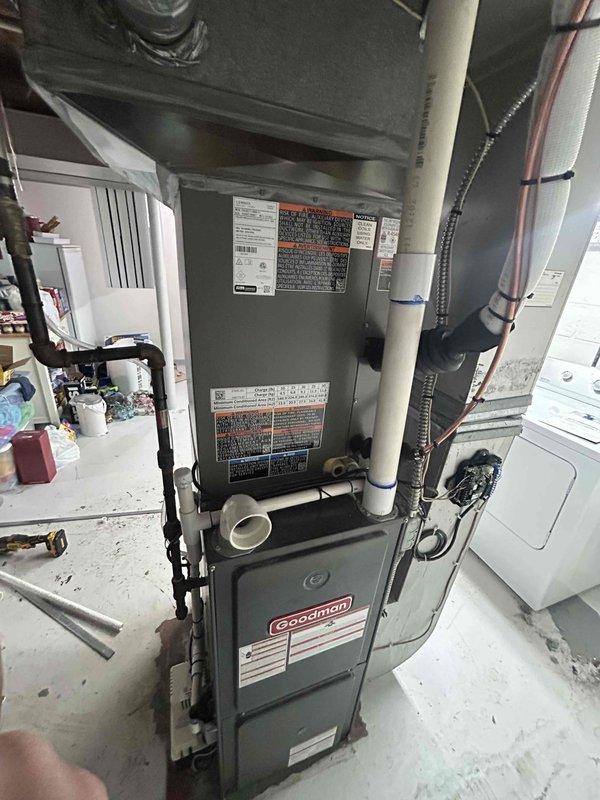Successfully completed installation of 2.5 ton air conditioning system with evaporator coil. Installed new Goodman AC unit with rear discharge configuration, mounted and secured evaporator coil to existing furnace system. Completed all mechanical connections including refrigerant lines, electrical wiring to breaker panel, and condensate drainage system with pump installation. Verified proper system operation, refrigerant charge, and airflow. All components tested and functioning within manufacturer specifications.