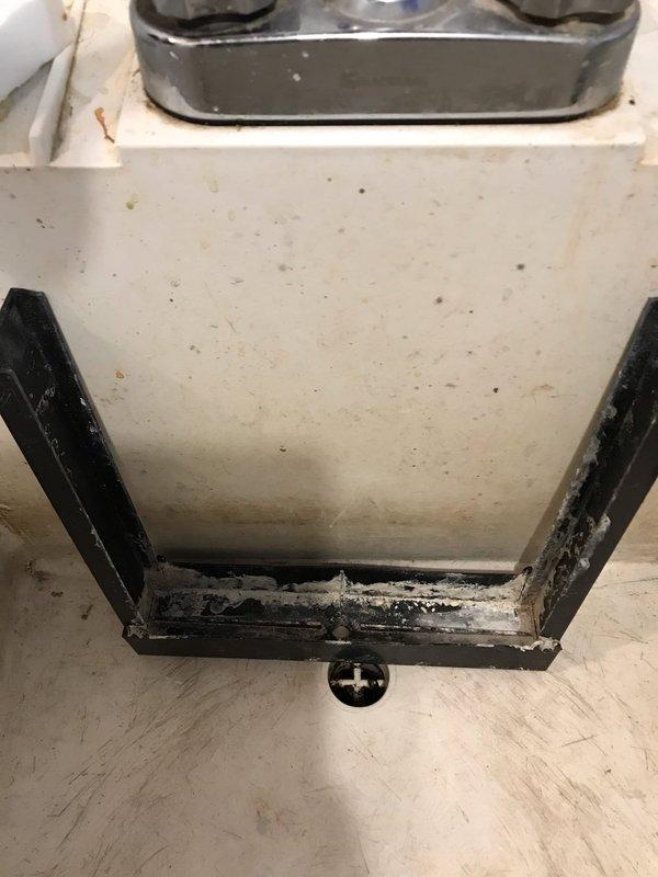 Completed preventive maintenance inspection on air handler unit as part of Club AC10-2 agreement. Performed visual inspection of internal components including evaporator coil housing, drain pan, and condensate drainage system. Documented existing conditions showing moderate dirt and debris accumulation in drain pan and significant corrosion on metal support frame at base of unit. Condensate drain line confirmed in place and operational. All interior components accessible and photographed for service records.