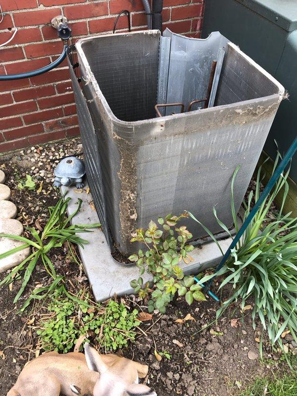 Completed scheduled AC maintenance tune-up on outdoor condenser unit positioned against brick wall. Performed comprehensive system inspection, cleaned condenser coils and exterior surfaces removing accumulated dirt and grime, checked refrigerant lines and connections, verified compressor operation, and documented equipment condition with photos. Unit operational and ready for cooling season.