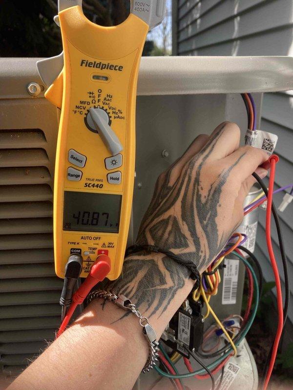 Completed preventive maintenance agreement visit for air conditioning system. Performed comprehensive electrical diagnostics using clamp meter, measuring voltage at 247V and capacitance at 10.07 MFD within the unit's control panel. Inspected and tested all electrical connections, including multiple control wiring circuits, to ensure proper system operation and safety compliance per manufacturer specifications.