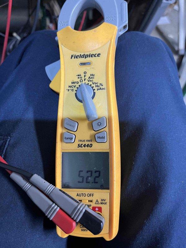 Completed scheduled air conditioner maintenance visit during afternoon service window. Performed comprehensive AC tune-up including system diagnostics and electrical testing using clamp meter, which recorded amperage readings of 523. Inspected and serviced condenser unit components, including examination of BOJACK brand dual-run capacitor (40/5µF CBB65 model) mounted on fan assembly. Verified proper electrical connections, assessed capacitor functionality, and confirmed condenser fan motor operation. All components found operating within normal parameters, and system ready for cooling season operation.
