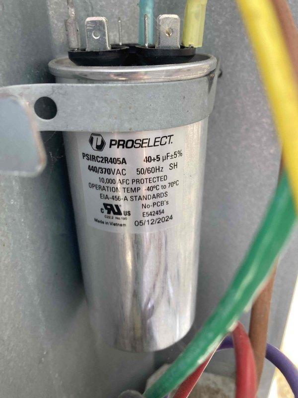 Performed preventative maintenance inspection on air conditioning system under CLUB AC 12-4 agreement. Inspected and tested dual-run capacitor (PROSELECT model PSIRC2R405A, rated 40+5 μF at 440/370V AC), verifying proper operation with measured capacitance reading of 39.78 μF, which falls within acceptable tolerance range of ±5%. Capacitor terminals, wiring connections, and mounting bracket were inspected and found secure with no signs of deterioration or damage.