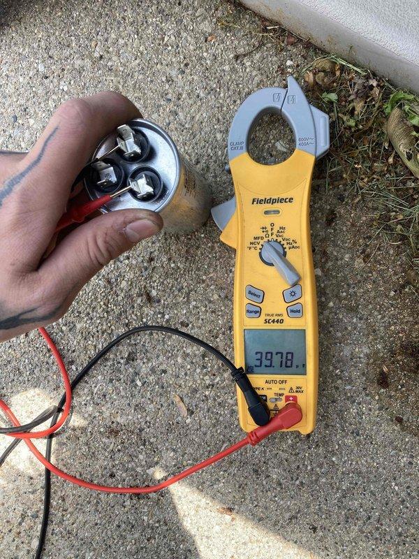 Performed preventative maintenance inspection on air conditioning system under CLUB AC 12-4 agreement. Inspected and tested dual-run capacitor (PROSELECT model PSIRC2R405A, rated 40+5 μF at 440/370V AC), verifying proper operation with measured capacitance reading of 39.78 μF, which falls within acceptable tolerance range of ±5%. Capacitor terminals, wiring connections, and mounting bracket were inspected and found secure with no signs of deterioration or damage.
