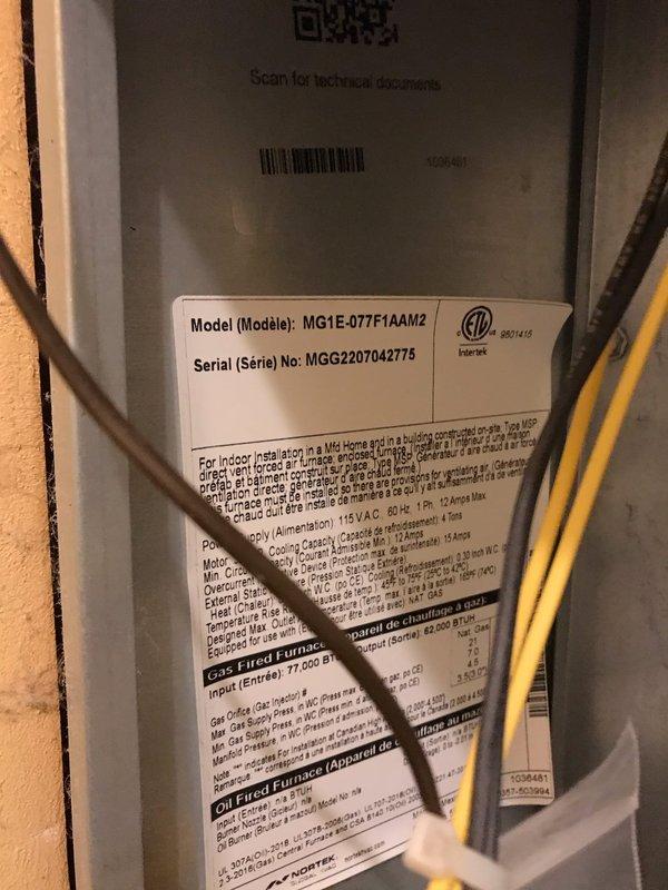 Performed HVAC maintenance agreement visit including air conditioning and system inspection. Customer reported storm damage to chimney or vent pipe requiring inspection and repair. Documented equipment specifications for Goodman furnace model MG1E-077F1AAM2 and Carrier air conditioning unit model PA13NA030-A with R-410A refrigerant. Inspected both systems and captured photographic documentation of manufacturer data plates showing proper certification marks and technical specifications. All equipment information verified and recorded for service history.