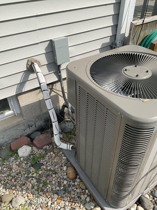 Completed comprehensive electrical estimate for whole home generator installation. Assessed existing electrical infrastructure including main service panel, meter base showing weather deterioration and rust staining, and current electrical distribution system. Evaluated optimal generator placement considering proximity to existing HVAC unit on concrete pad, available space in landscaped area with river rock ground cover, and accessibility for fuel line connections. Documented existing electrical components including gray junction boxes, conduit routing, and disconnect switch locations to determine transfer switch installation requirements and necessary electrical upgrades for generator integration with home's electrical system.