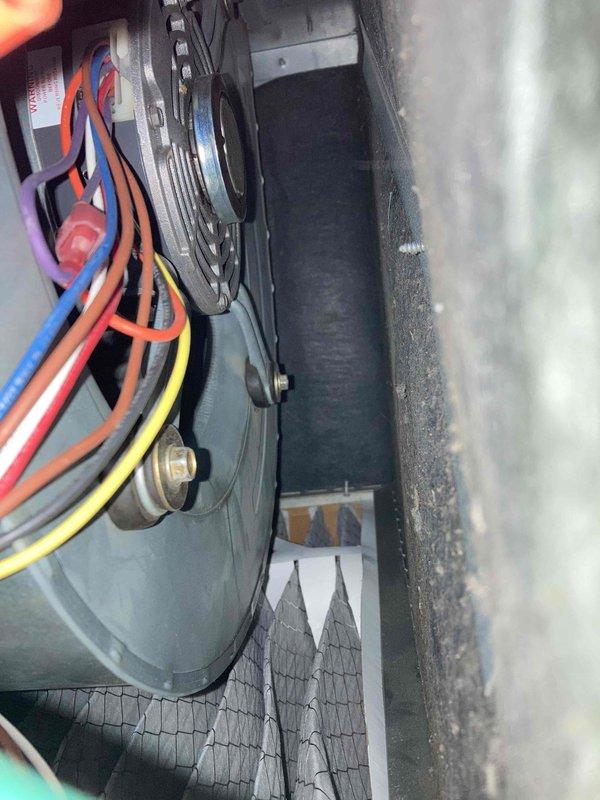 Completed Club AC8-12 preventive maintenance agreement visit on air conditioning system. Performed comprehensive inspection of air handler components including blower motor assembly and electrical connections. Verified proper amperage draw at 0.5 amps using calibrated Fluke SC440 True RMS clamp meter, confirming motor operating within normal parameters. Inspected all electrical wiring connections including red, blue, orange, and yellow motor leads for secure terminations and proper routing. Checked voltage readings and confirmed system electrical integrity. Examined blower motor mounting, shaft alignment, and cabinet insulation condition. All components found operating properly with no deficiencies noted. System running efficiently per manufacturer specifications.