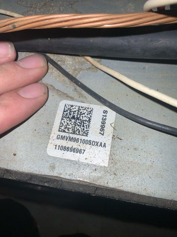 Responded to no-heat condition on tankless water heater unit. Upon inspection, accessed and evaluated the internal blower assembly and heat exchanger components. Examined the blower wheel housing and verified proper clearances of the centrifugal fan blades within the volute chamber. Documented equipment model number GMVM961005DXAA and serial number for service records. Inspected refrigerant lines, copper piping connections, and insulated tubing for proper installation and potential restrictions. Assessed the overall condition of the unit's internal components, noting normal wear patterns on metal surfaces. Unit was evaluated for operational readiness and proper airflow through the heat exchanger assembly.