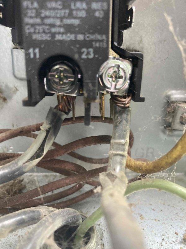 Completed preventive maintenance agreement visit for Club AC8-12 service on air conditioning and system inspection. Performed thorough inspection of air handler unit, verified proper air filter installation and condition within the pleated filter housing. Documented significant electrical concerns at contactor assembly, including severe copper wire corrosion and oxidation on multiple conductors with deteriorated insulation on white, yellow, and green wires. Terminal connections show heavy patina buildup indicating prolonged moisture exposure and age-related degradation requiring immediate attention to prevent potential electrical failure or safety hazards.