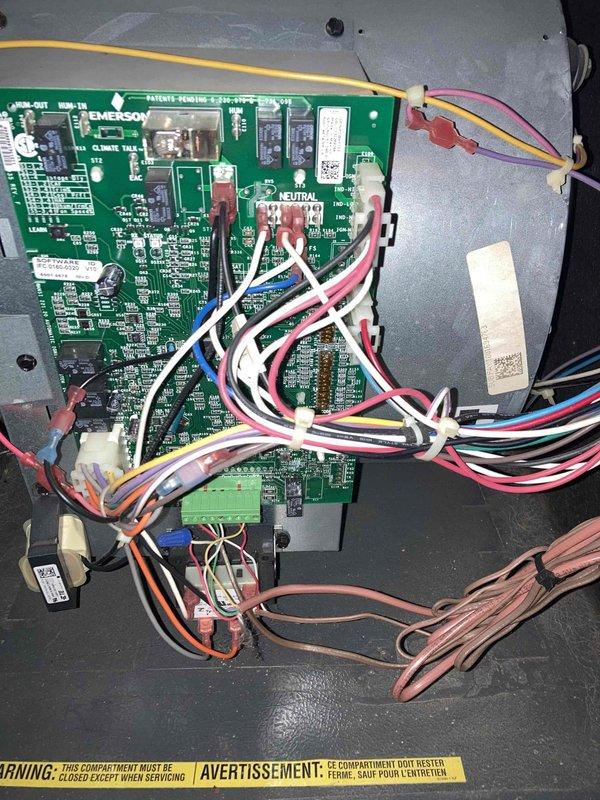 Completed scheduled maintenance agreement visit for air conditioning system. Performed comprehensive system inspection including electrical testing of Emerson control board and verification of proper voltage readings using digital multimeter, measuring 0.73 AC volts at tested points. All electronic components, wire harnesses, and connections inspected and found to be in proper working condition with no issues identified.