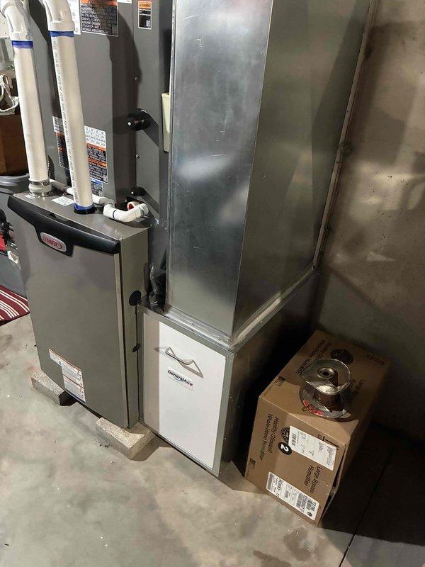 Completed full HVAC system installation including a 90,000 BTU furnace, 3-ton air conditioning unit positioned on the right side, and humidifier integration. Performed all mechanical and electrical connections, installed proper venting with white PVC piping, and configured ductwork with galvanized sheet metal components. System was reconnected, tested for proper operation, and left in full working order.