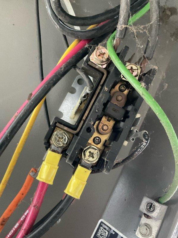 Completed prepaid membership AC maintenance tune-up on residential air conditioning system. Performed comprehensive system inspection including electrical connections at terminal block, verified proper wire terminations and grounding, and inspected attic-mounted equipment and insulation conditions. All components found operating within normal parameters with no immediate repairs required.