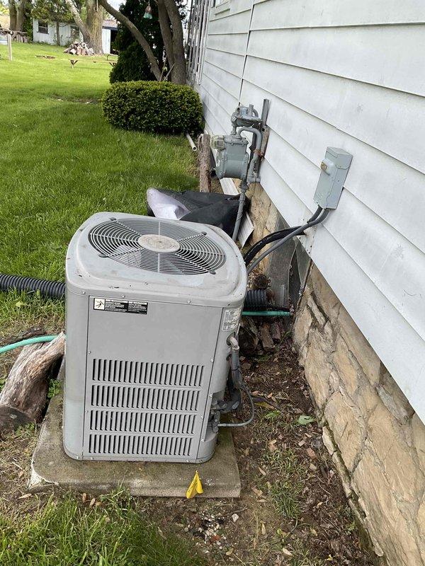 Conducted comprehensive on-site evaluation for HVAC system replacement estimate. Assessed existing outdoor air conditioning condenser unit, refrigerant line configuration, electrical disconnect components, and indoor furnace system. Photographed current equipment installation, including exterior condenser placement on concrete pad, refrigerant line routing along exterior wall, electrical panel configuration, and circuit directory for accurate replacement specifications. Prepared multiple quote options including complete HVAC system replacement, standalone furnace replacement, and water heater replacement to provide comprehensive equipment upgrade solutions.