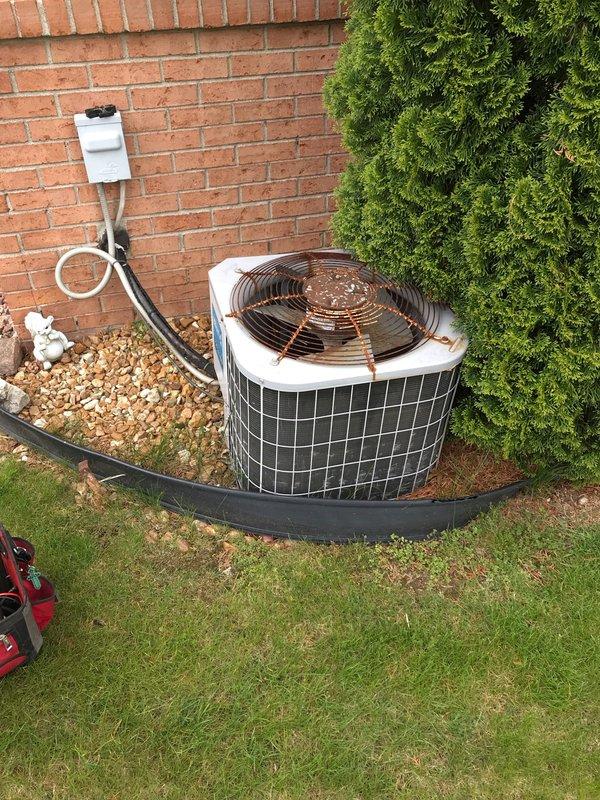 Completed preventative maintenance agreement visit on residential split system air conditioning unit. Performed comprehensive inspection of outdoor condenser unit including visual assessment of fan assembly, refrigerant lines, electrical disconnect, and overall unit condition. Both condenser units inspected and photographed, confirmed proper installation on gravel pad with appropriate drainage, verified refrigerant line connections secure, and documented system components in operational condition per maintenance agreement protocol.
