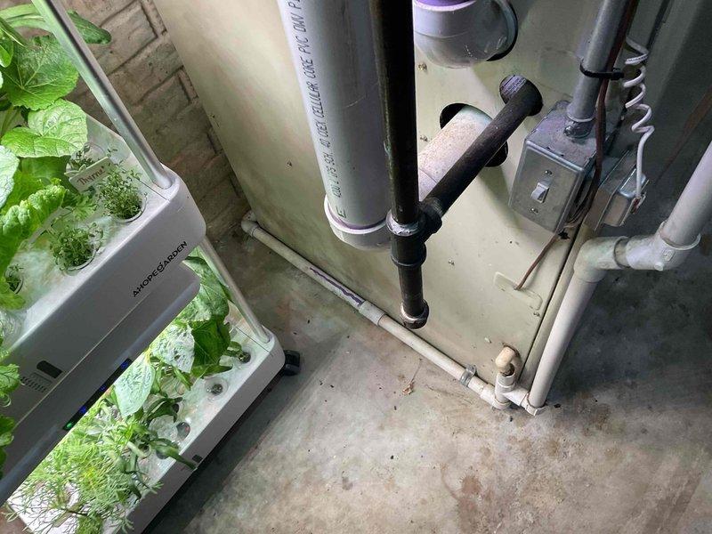 Completed on-site evaluation for HVAC system replacement estimate at residential property. Assessed existing furnace/air handler unit located in basement utility area, documented electrical panel configuration and circuit capacity for new equipment installation requirements, and photographed current system setup including supply piping, condensate drainage, and available clearances for replacement unit sizing.