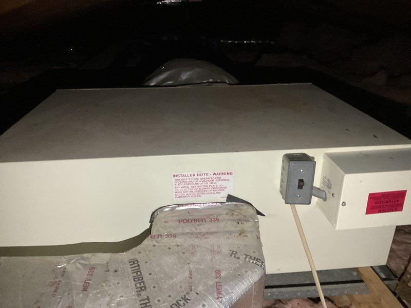 Conducted attic inspection and assessment of existing HVAC air handler system to provide replacement estimate for air conditioning equipment. Documented current installation including white air handler unit, refrigerant line sets with black insulation, electrical connections, and flexible ductwork. Photographed equipment specifications, warning labels, and existing mechanical components to develop accurate quote for AC system replacement. Discussed financing options with customer for proposed equipment upgrade.