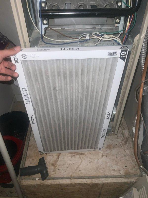 Completed preventative maintenance inspection on residential HVAC system under club AC8-12 agreement. Inspected and documented air handler unit, noting 14x25x1 air filter with moderate dust accumulation and visible dirt on unit base. Examined evaporator coil assembly and refrigerant line connections, observing significant rust and corrosion on copper refrigerant piping throughout U-bend sections, along with deteriorated foam insulation on refrigerant lines showing signs of age and wear requiring future attention.