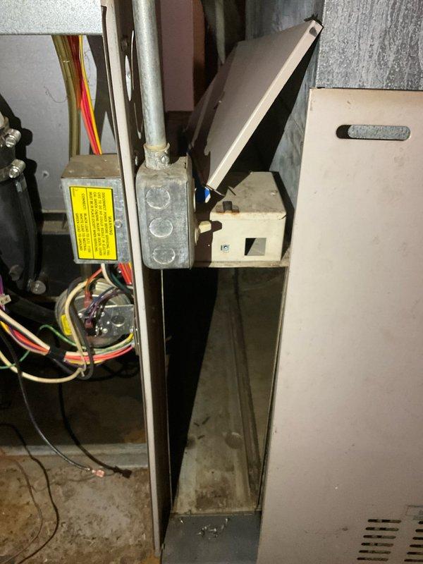 Completed comprehensive assessment of existing furnace system for replacement estimate. Documented current equipment configuration including furnace unit, electrical connections, ductwork arrangement, and venting system with PVC piping. Evaluated accessibility of equipment for potential replacement, photographed interior components showing wire connections and safety labeling, and assessed mechanical room layout to determine installation requirements for new system.