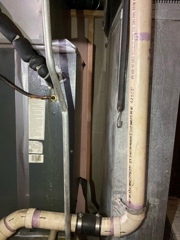 Completed comprehensive assessment of existing furnace system for replacement estimate. Documented current equipment configuration including furnace unit, electrical connections, ductwork arrangement, and venting system with PVC piping. Evaluated accessibility of equipment for potential replacement, photographed interior components showing wire connections and safety labeling, and assessed mechanical room layout to determine installation requirements for new system.