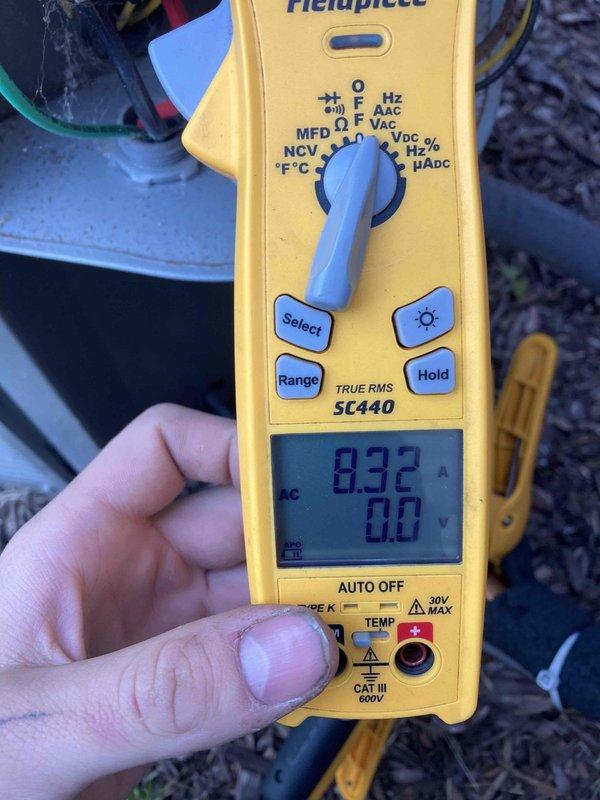 Completed preventive maintenance agreement visit for Club AC8-12 service on air conditioning system. Performed comprehensive electrical diagnostics using digital multimeter, recording amperage draw of 8.32 amps and supply voltage of 92.9 volts to verify proper system operation and component performance within manufacturer specifications.