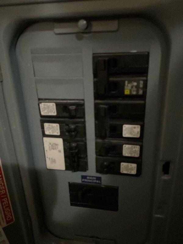 Conducted on-site assessment of existing mobile home furnace system to provide replacement estimate. Inspected furnace unit located in utility space, documenting current equipment condition including metal enclosure, ductwork configuration, and ventilation components showing age-related wear and dust accumulation. Evaluated electrical panel and circuit breaker arrangement to determine compatibility requirements for new furnace installation. Photographed existing equipment setup and electrical infrastructure to support accurate replacement specifications and material requirements for quote preparation.