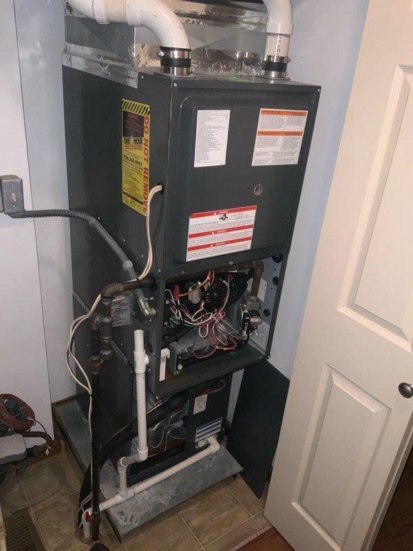 Completed scheduled CLUB AC 8-12 maintenance agreement visit on residential HVAC system. Performed comprehensive inspection of furnace unit, including examination of blower wheel assembly which showed normal condensation and proper operation of radial fins. Removed front access panel to inspect internal components, verifying all electrical connections, gas lines, control boards, and refrigerant lines were secure and functioning within specifications. All system components operating normally with no deficiencies noted.