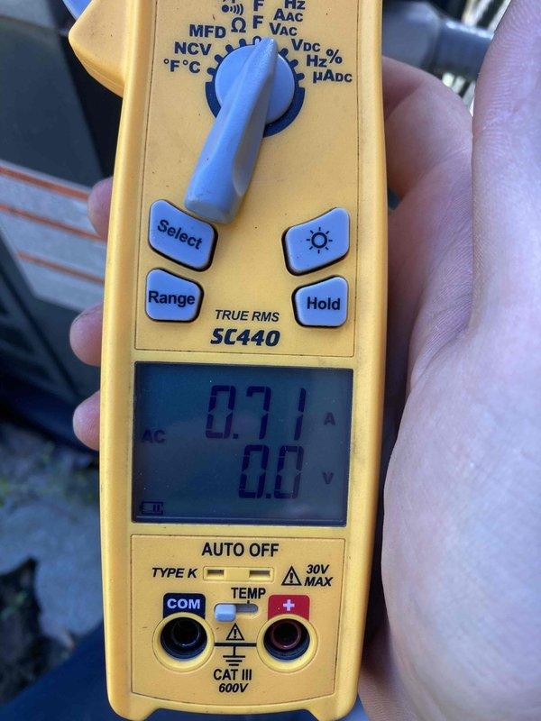 Completed Club AC10-2 preventive maintenance agreement visit on air conditioning system. Performed operational diagnostics using clamp meter to verify system amperage at 0.71A, confirming compressor draw within manufacturer specifications. Inspected and documented electrical disconnect box and AG3000 series surge protection device with operational indicator light functioning properly.