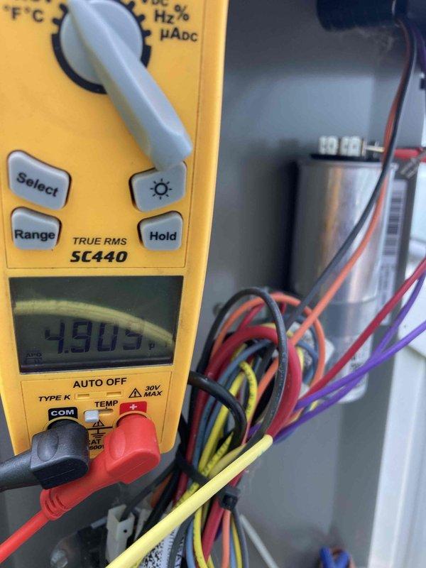 Completed preventive maintenance inspection on air conditioning system as part of club AC10-2 agreement visit. Performed electrical diagnostics using digital multimeter, measuring amperage draw of 0.65A and conducting voltage tests throughout the system. Inspected and tested all electrical components including capacitor and control wiring connections to verify proper operation and system performance.