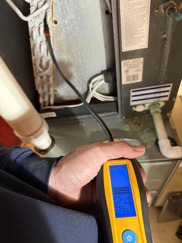 Responded to no cooling complaint on 9-year-old central air conditioning system experiencing reduced airflow after several hours of operation. Upon arrival, performed diagnostic testing using digital multimeter to assess system performance. Inspection revealed evaporator coil freeze-up condition consistent with refrigerant undercharge. Visual examination of evaporator coil showed evidence of ice formation and moisture accumulation on coil surfaces. Tested electrical components and verified proper system operation during initial startup phase. Diagnosed refrigerant leak as root cause of intermittent cooling loss and ice buildup on evaporator coil. Explained findings to customer regarding low refrigerant levels causing coil temperatures to drop below freezing point, resulting in ice formation that blocks airflow through registers. Recommended leak detection service and refrigerant recharge to restore proper system operation and prevent future freeze-up conditions.