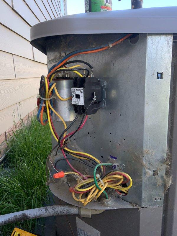 Responded to no cooling complaint on 6-year-old residential air conditioning system. Upon arrival, performed diagnostic evaluation of outdoor condensing unit and indoor air handler components. Inspected electrical connections, capacitor, and contactor in outdoor unit electrical compartment. Examined blower wheel assembly and verified proper operation of air handling components. System restored to normal cooling operation after addressing electrical connection issues and verifying all components functioning within manufacturer specifications.