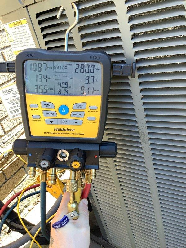 Completed routine CLUB AC 8-12 preventative maintenance agreement visit on air conditioning system. Performed comprehensive diagnostic testing using digital multimeter to verify electrical measurements at 317 volts, confirming proper power supply to unit. Utilized digital gauge manifold to monitor refrigerant pressures and temperatures, recording low-side pressure at 10.8 PSI and high-side pressure at 280.0 PSI with corresponding temperature readings of 134°F and 97°F. System operating within normal parameters. All measurements documented for maintenance records.