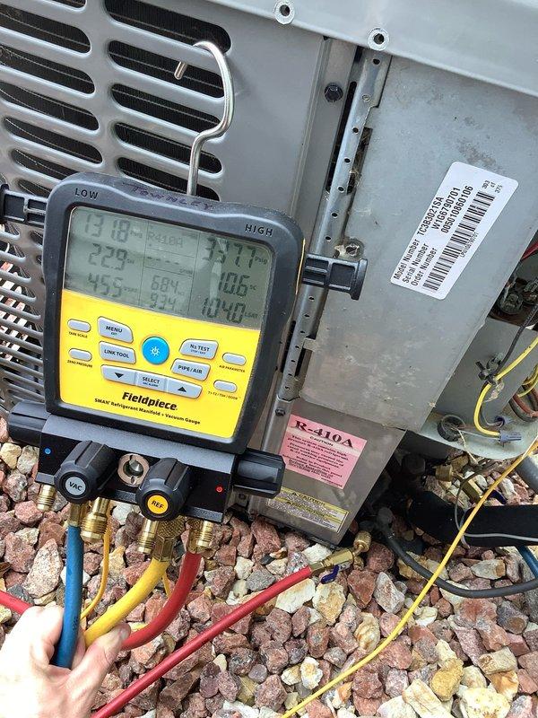 # HVAC Service Report

Responded to no cooling complaint on 10-year-old residential air conditioning system. Upon arrival, performed comprehensive system diagnostics using digital manifold gauges to assess refrigerant pressures and system performance. Testing revealed low refrigerant charge in the R-410A system. Connected refrigerant recovery and charging equipment, including calibrated digital scale with alarm functionality, to accurately measure and add refrigerant to manufacturer specifications. Verified proper system operation, pressures, and cooling performance upon completion. System restored to normal cooling operation.