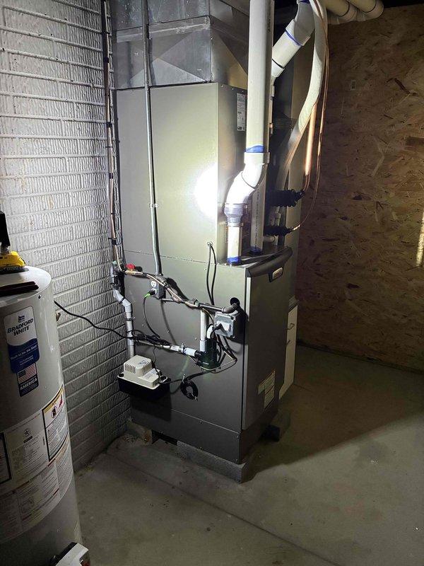 Completed full HVAC system installation including a 90,000 BTU furnace and 3-ton air conditioning unit positioned on the left side of the property. Performed all mechanical and electrical connections, installed PVC venting system, and reconnected existing hot water heater. Installed Lennox programmable thermostat with digital display and verified all equipment operational with proper temperature control and system functionality.