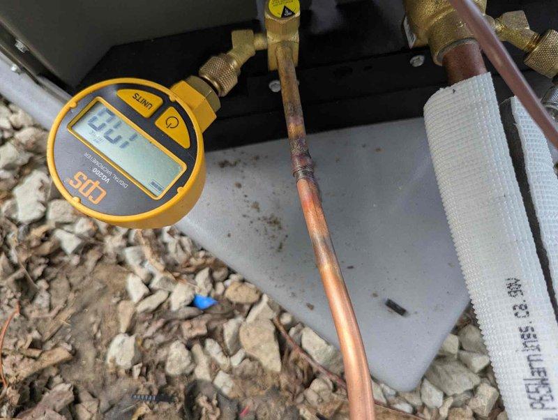 Completed full HVAC system installation including a 70,000 BTU Lennox furnace and 2-ton air conditioning unit with rear discharge configuration. Installation included all necessary mechanical and electrical connections, integration of humidifier system, and reconnection of existing components. System was pressure tested showing proper refrigerant charge at 127 PSI, with all copper refrigerant lines properly insulated and secured. Furnace was mounted on concrete blocks in basement location with complete PVC venting system installed, electrical panel connections completed, and all ductwork properly configured and sealed.