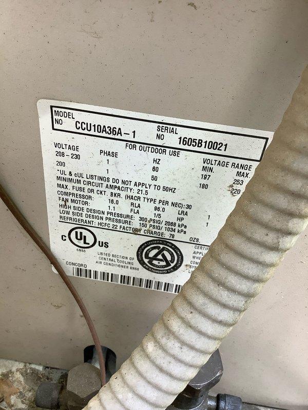Responded to no cooling call on 10+ year old Carrier outdoor unit model CCU10A36A-1. Upon arrival, found unit not communicating with thermostat despite customer replacing batteries. Performed diagnostic testing using clamp meter, which revealed electrical readings of 99.7 amps indicating compressor attempting to operate outside normal parameters. Inspected outdoor unit and found substantial debris accumulation including leaves, dirt, and organic material surrounding equipment and wiring connections. Noted unit contains R-22 refrigerant and is rated for 208-230V operation with 18.0 RLA compressor specifications. Identified communication failure between thermostat and outdoor unit as primary issue preventing proper cooling operation. Customer declined equipment replacement at this time.