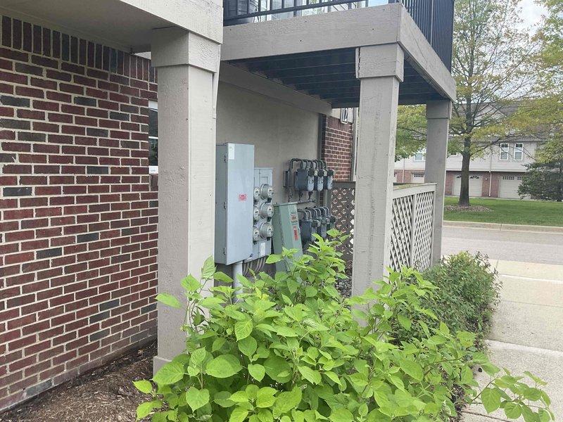 Conducted comprehensive on-site assessment of condominium HVAC system and water heating equipment to provide multiple replacement estimates. Evaluated existing beige HVAC unit with air handler, galvanized ductwork configuration, and white cylindrical water heater with expansion tank in utility room. Documented current equipment specifications, ductwork routing, copper piping connections, and electrical service infrastructure located in exterior concrete alcove between buildings. Photographed existing installations and measured space constraints to develop single component replacement option, full HVAC system replacement quote, and separate water heater replacement proposal for customer consideration.