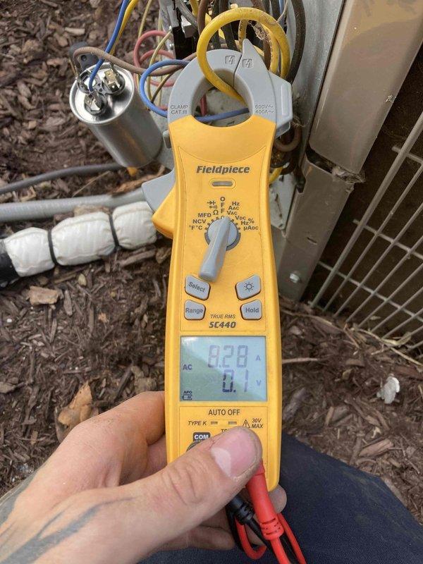 Responded to no cooling complaint on residential air conditioning system. Upon arrival, performed electrical diagnostics on outdoor condensing unit using clamp meter to test voltage, amperage, and capacitance values. Testing revealed failed capacitor requiring replacement. Replaced defective dual run capacitor, verified proper electrical readings across all components, and confirmed system returned to normal cooling operation.
