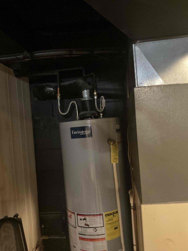 Conducted water heater replacement estimate at residential property. Assessed existing Envirotemp water heater installation in basement utility area, documenting current unit specifications, plumbing connections, and surrounding clearances. Evaluated installation space constraints, existing gas/water line configurations, and venting requirements. Photographed current equipment setup including water heater, furnace, and associated mechanical systems to provide accurate replacement proposal. Customer availability window accommodated between 3:30 PM and 6:00 PM for consultation and estimate review.