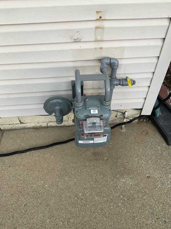 Performed on-site evaluation of a 20+ year old R22 air conditioning system with a failed condenser fan motor. Upon inspection, confirmed motor failure and noted the evaporator coil fins were in poor condition due to age and wear. Documented the existing equipment configuration including outdoor condensing unit and indoor air handler components. Photographed the installation for estimate preparation purposes. Provided comprehensive replacement options to address the obsolete R22 refrigerant system and deteriorated components, discussing modern high-efficiency equipment alternatives suitable for the application.