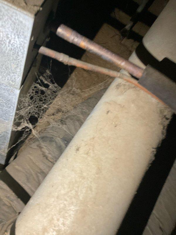 Performed on-site evaluation of a 20+ year old R22 air conditioning system with a failed condenser fan motor. Upon inspection, confirmed motor failure and noted the evaporator coil fins were in poor condition due to age and wear. Documented the existing equipment configuration including outdoor condensing unit and indoor air handler components. Photographed the installation for estimate preparation purposes. Provided comprehensive replacement options to address the obsolete R22 refrigerant system and deteriorated components, discussing modern high-efficiency equipment alternatives suitable for the application.